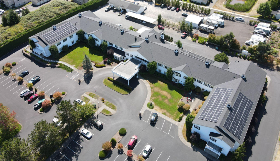 Aerial photo of the Colonial Residence complete with a solar array