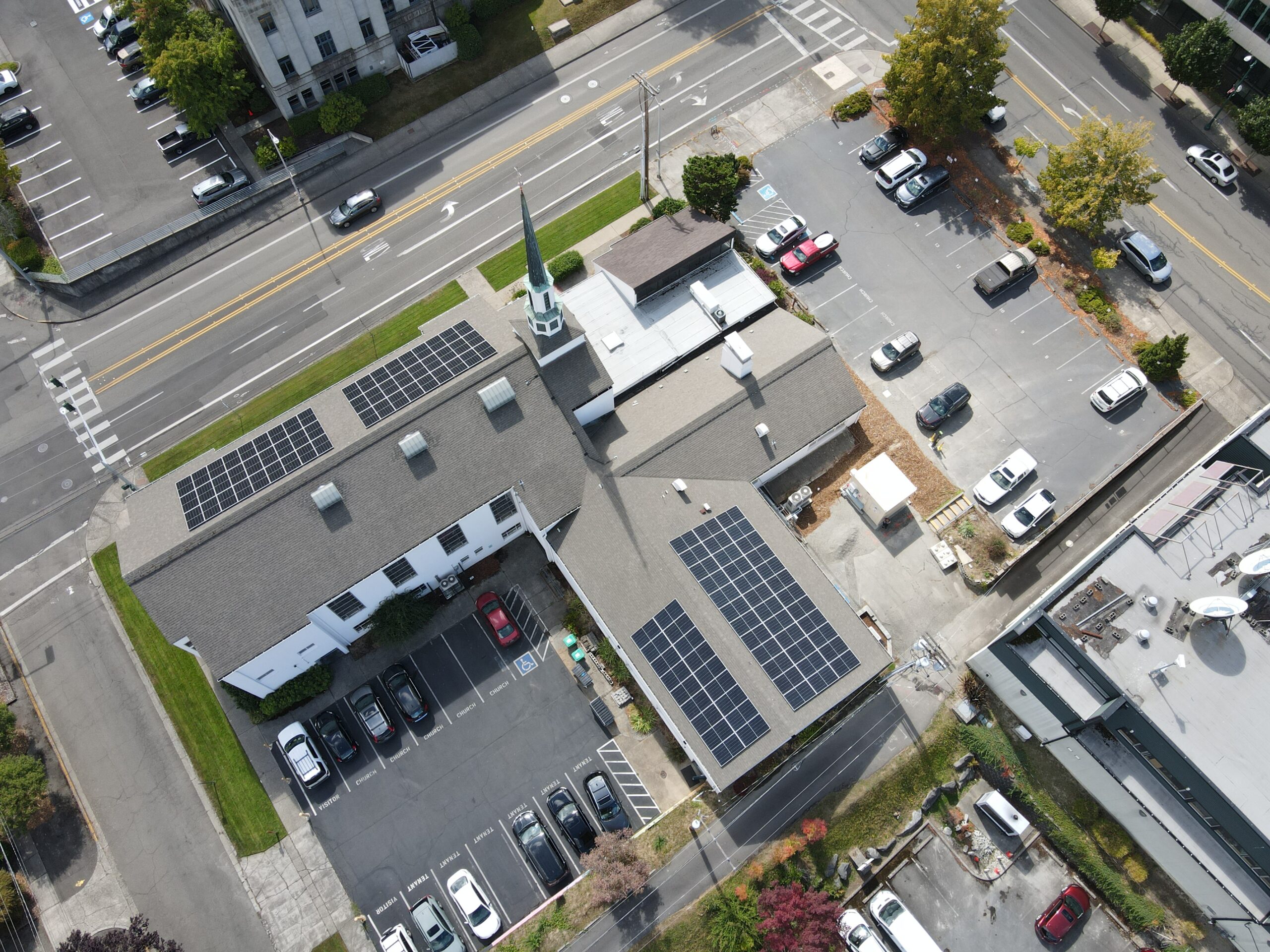 Birds-eye view of the church with a solar array on the roof.